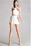 Set with embroidered crop top and floral shorts