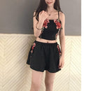 Set with embroidered crop top and floral shorts