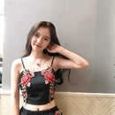 Set with embroidered crop top and floral shorts