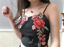 Set with embroidered crop top and floral shorts