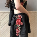 Set with embroidered crop top and floral shorts